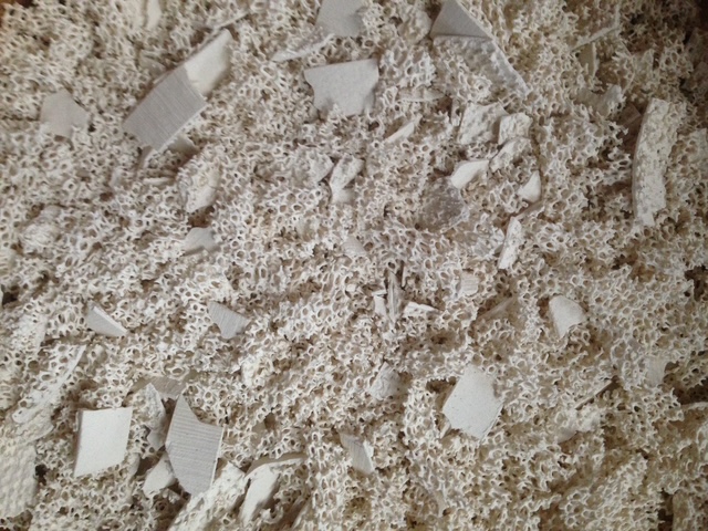 Crushed zirconia material fragments and powder.
