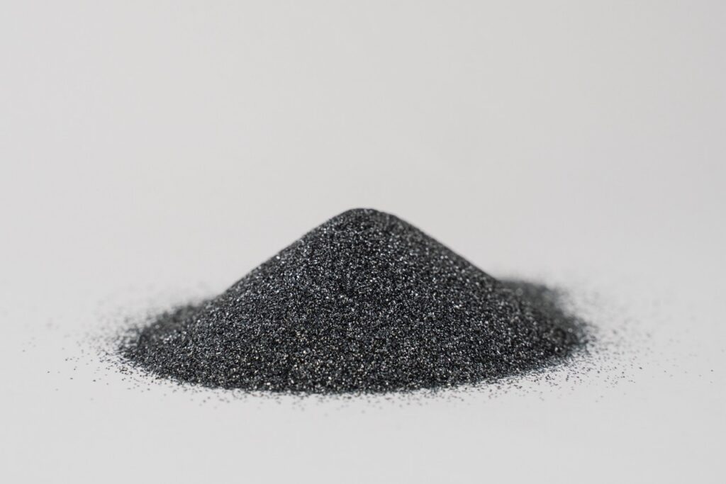 Silicon carbide powder close-up isolated on white background. Silicon carbide abrasive grit for restore stones to original flatness and leveling sharpening stones